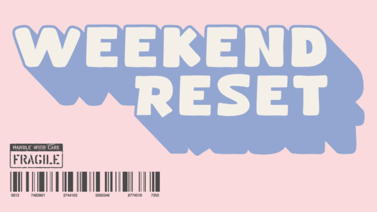 Weekend Reset: checklist on table with candle and cup of tea.